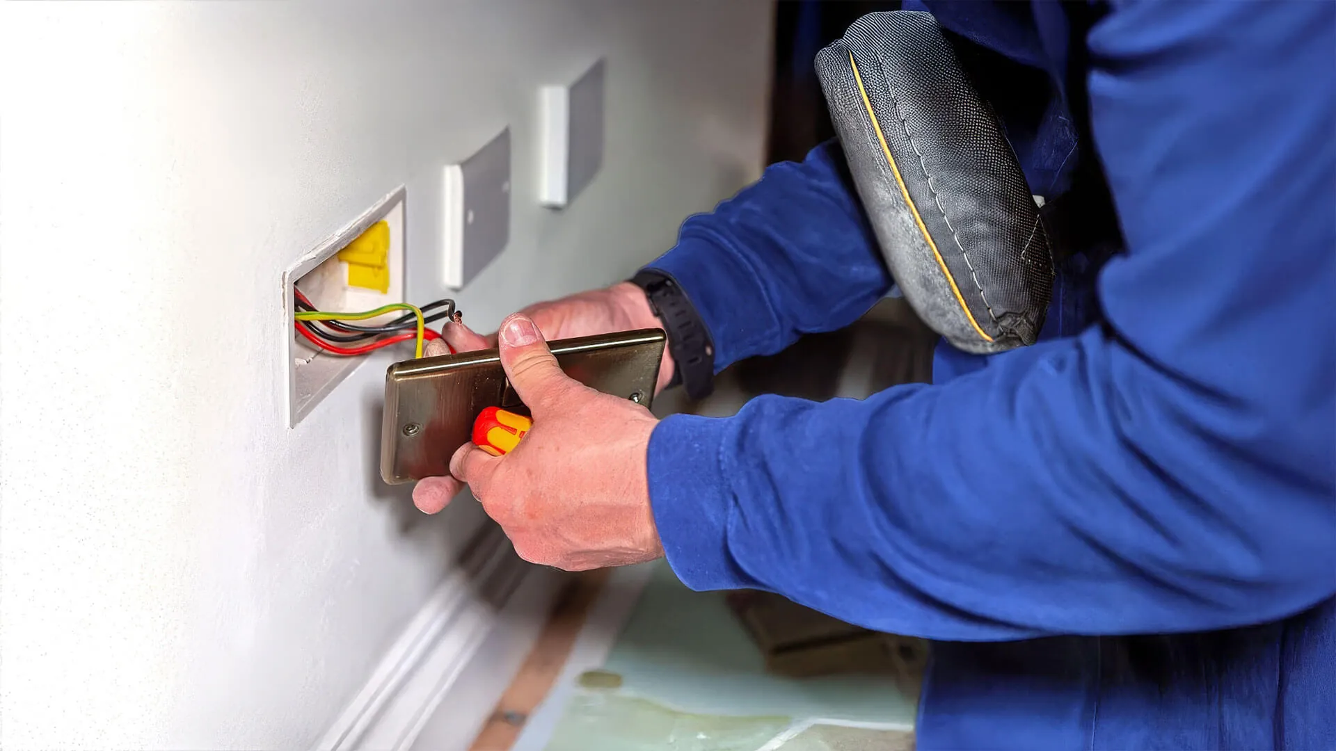 Electrician completing permanent emergency electrical repair on the Gold Coast