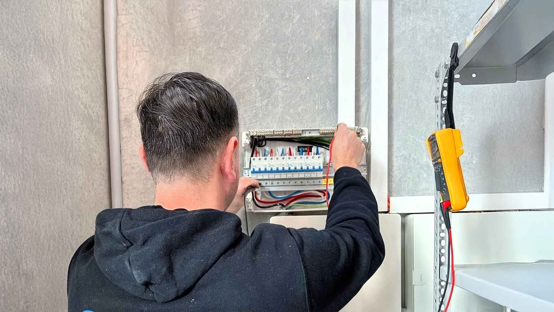 New switchboard being installed with modern circuit breakers